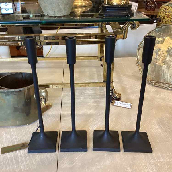Four Black Metal Candlesticks