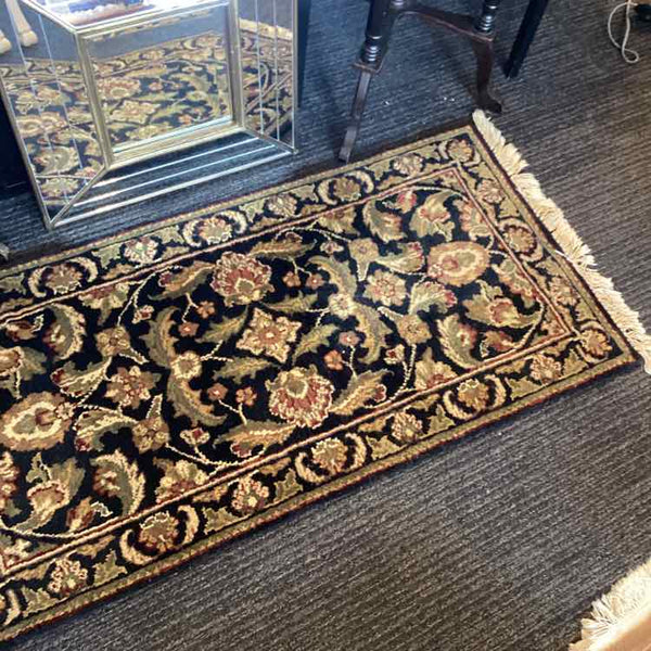 Black, Tan, Green, and Rust Rug