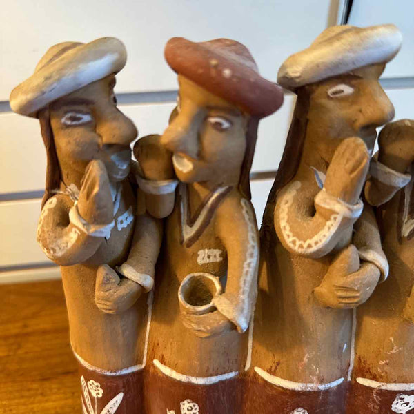 Sculpture Of Men Telling Secrets