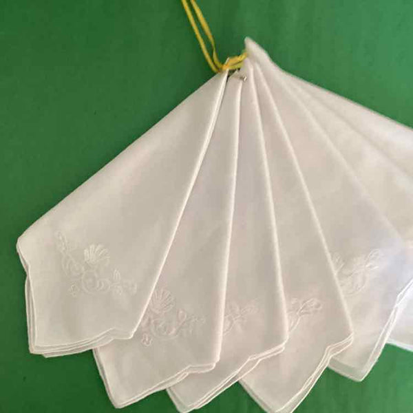 Seven White Cotton Napkins