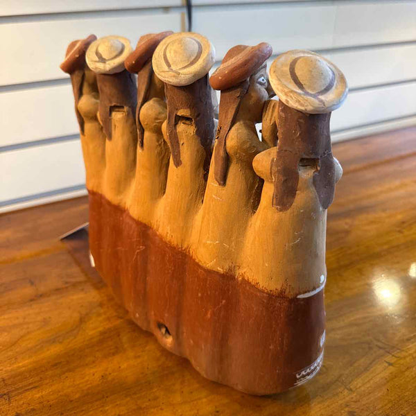 Sculpture Of Men Telling Secrets