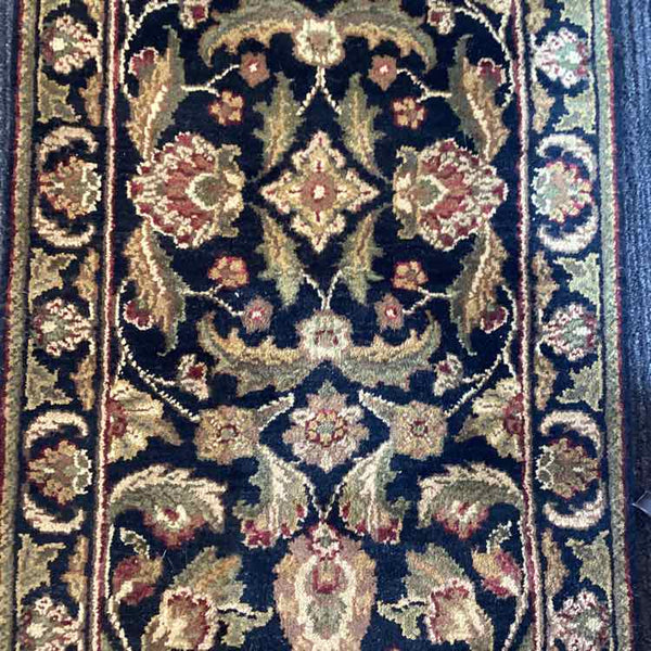 Black, Tan, Green, and Rust Rug