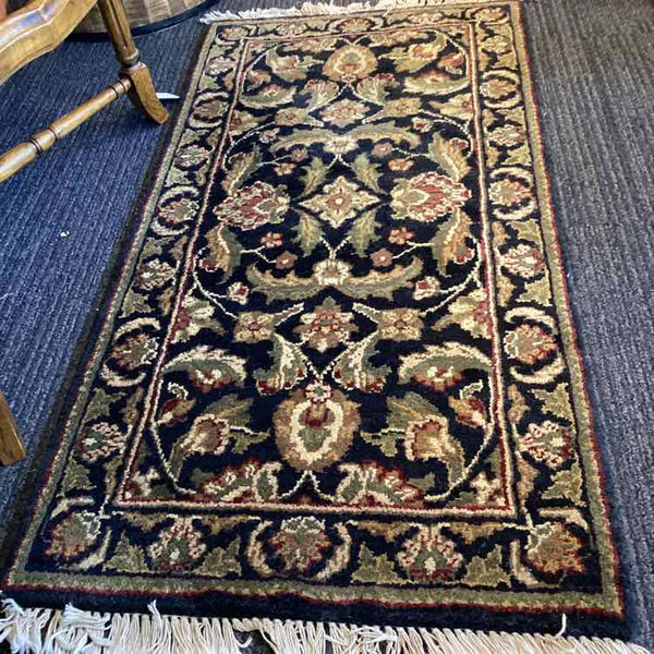 Black, Tan, Green, and Rust Rug