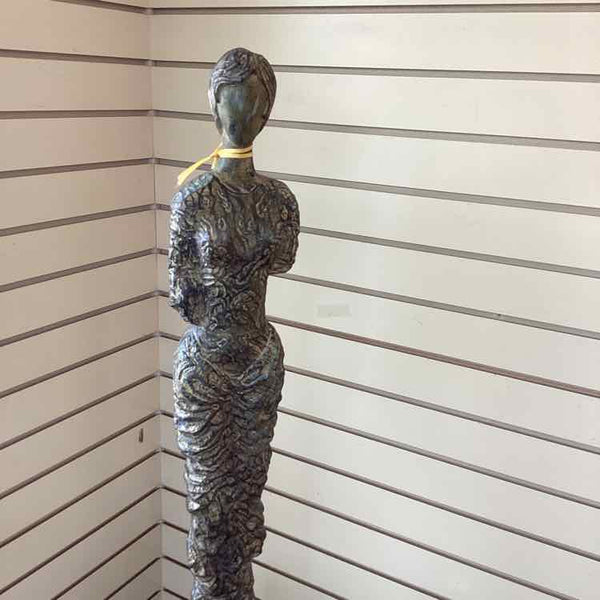 "As Is" Statue Of Woman