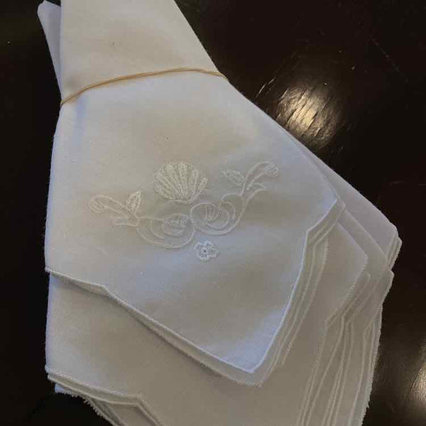 Seven White Cotton Napkins