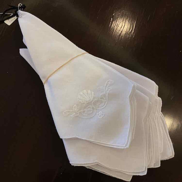 Seven White Cotton Napkins