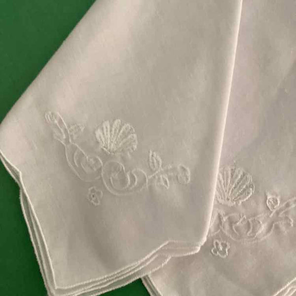 Seven White Cotton Napkins